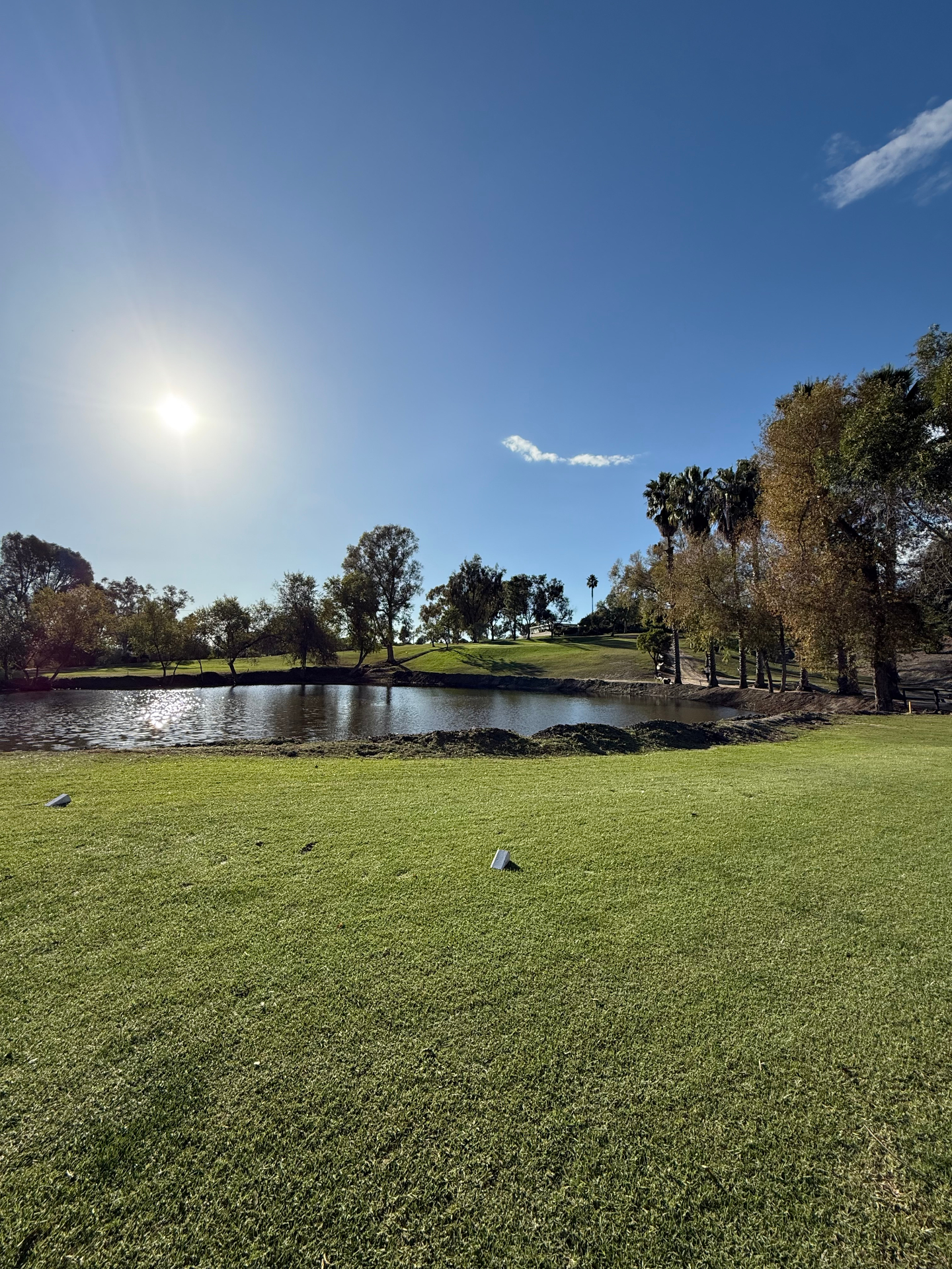 Sunny fairway with pond at Emerald Isle